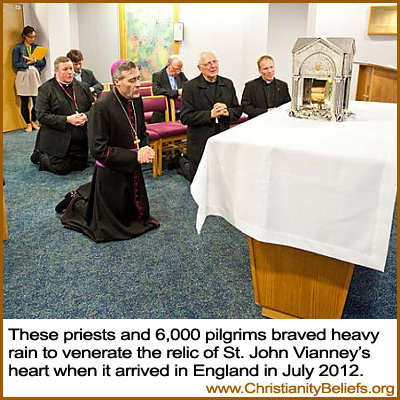 Catholic priests venerate the relic of St. John Vianney's heart in England