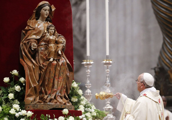 Pope Francis swings incense before the Blessed Virgin Mary